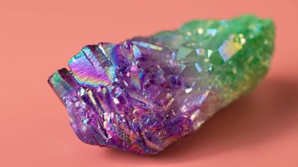 Natural quartz crystal with a bright luster. Angel Aura Quartz for healing, practice, reiki, meditation. Natural semi-precious stone close-up